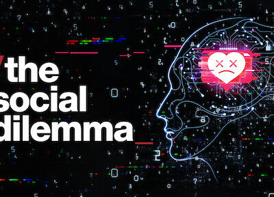 Filmaffisch med texten The Social Dilemma och en silhuett av ett ansikte i profil och inne i huvudet en hjärtemoji med kryss som ögon.